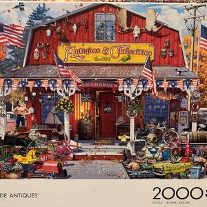 Buffalo Games 2000 piece “Roadside Antiques” jigsaw puzzle.